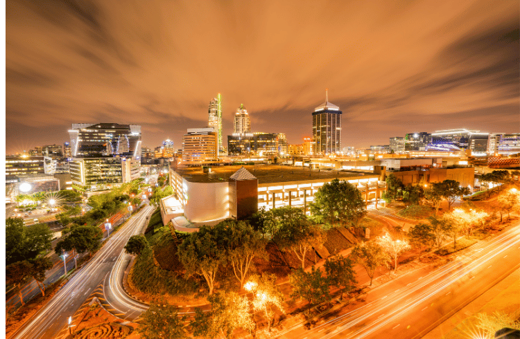 Young professionals outside Indwe Risk Services building in Johannesburg, eager to embark on their 2024 internship and learnership journey in the Short-Term insurance domain.