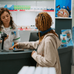 Dis-Chem cashier assisting a customer